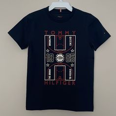 Tommy Hilfiger Hlow In The Dark Graphic Tee Printed Basketball Ny City 5-Borough Tee Material; Organic Cotton Size 8 New With Tag Affordable Under Armour Letter Print Tops, Ny City, Tommy Hilfiger Shirts, Kids Graphic Tees, In The Dark, Kids Shirts, Glow In The Dark, The Darkest, Graphic Tee