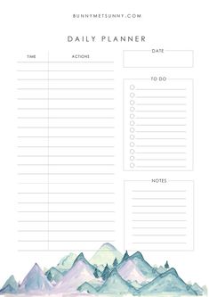 a daily planner with mountains in the background