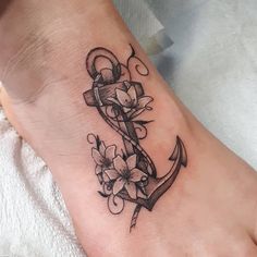 an anchor with flowers on the foot