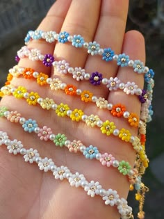 Hello🌸😊  Would you like to carry spring colors on your arms? Don't pass by without taking a look at our daisy bracelets made with beautiful colors and seed beads. The most beautiful daisy gifts for you and your loved ones. You can choose our daisy bracelets made of seed beads for birthdays, anniversaries, Mother's Day, graduations and any celebration moment you can think of. You can contact us for the designs and colors you want. Materials: * Preciosa seed beads * Glass pearl * Dorica beads * Gold plated lobster claw * Gold plated extension chain * All products are made with premium quality beads. It is completed with gold-plated materials. Utilization: Each of our products is carefully made for you. Avoid pulling too hard. * Remove your bracelets to sleep, sweat, swim, or shower  * Hand Small Bead Bracelets Ideas Flower, Daisy Gifts, Daisy Bracelets, Spring Bracelets, Daisy Chain Bracelet, Daisy Flower Bracelet, Flower Beaded Bracelet, Beaded Flower Bracelet, Spring Bracelet