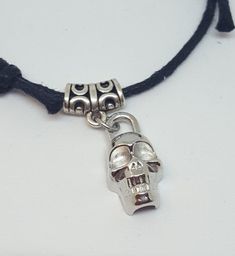 "Skull Bracelet/ Macrame Bracelet/Cord Bracelet/Adjustable Bracelet/Faux Suede Cord Bracelet/ Black Bracelet/Gift for Him or Her Faux leather knotted skull bracelet. The bracelet is faux leather cord with skull connector charm. The charm is quarter sized at about 1/2\" in diameter, and is displayed on a silver bail. The ends of all knots are glued with jewelry glue to insure quality as well. The bracelet will easily fit a wrist from 6\" to 9\" with ease in that it is adjustable and easy to wear! Pretty Face Mask, Handmade Casual Skull Bracelets, Handmade Casual Skull Bracelet, Adjustable Gothic Skull Bracelets, Black Gothic Skull Bracelet, Handmade Black Skull Bracelet, Skull Bracelet, Suede Cord, Black Bracelets