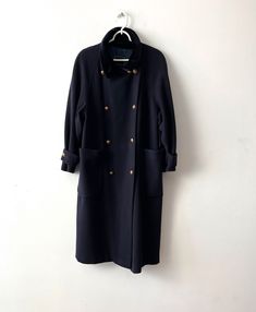 "Vintage Women's Wool blend Military Style Coat Gil Bret Retro Coat Office Women's Coat Medium size Double-breasted coat Midi navy coat with large pockets Label size: 38; F 40; I 44; GB 12 Estimated size: M Measurements: (lying flat) Length - 47\"/ 119.5 cm Pit to pit: 23\"/ 58.5 cm Waist - 23.5\"/ 59.7 cm Sleeve - 30\"/ 76 cm(from neckline) Please check measurements to insure a proper fit. Remember to allow yourself some extra room for movement. You can compare these with something from your cl Winter Career Outerwear With Double-breasted Buttons, Double-breasted Winter Outerwear For Career, Winter Double-breasted Career Outerwear, Navy Double-breasted Outerwear For Office, Fall Workwear Long Peacoat, Long Peacoat For Workwear With Buttons, Fall Long Peacoat For Workwear, Fall Long Peacoat For Work, Navy Collared Outerwear For Work