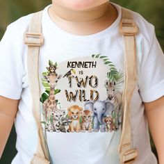 Celebrate your little adventurer's 2nd birthday with this cute "Two Wild Safari Animals second Birthday T-shirt design by PixeliaDesigns," a perfect keepsake for your guest of honor! This charming t-shirt features a delightful watercolor design of safari animals and tropical leaves, bringing a touch of the wild to the party. Personalize it with the name of your baby boy, making it a unique and memorable outfit for his big day. Ideal for birthday celebrations, this t-shirt not only serves as ador 2 Year Birthday Animals, Two Wild Birthday Outfit, Two Wild Shirt Boy, Safari Birthday Shirt, Two Wild Family Birthday Shirts, Stylish Jeans, Stylish Kids, Toddler Boy Outfits, Safari Animals