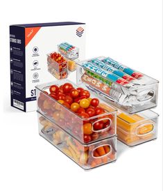 three plastic containers filled with different types of fruits and vegetables in front of a box