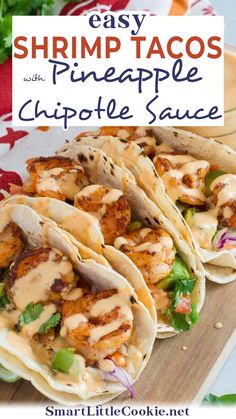 easy shrimp tacos with pineapple chipotle sauce on a wooden cutting board