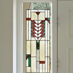 a white door with a stained glass window