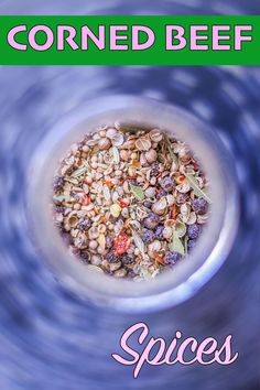 a bowl filled with lots of different types of food on top of a blue table