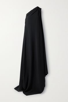 Balenciaga's gown features a dramatic cape-effect back that drapes down to the floor and leaves a short train. Made from crepe, it has an asymmetric neckline and frayed edges for a purposely undone feel. Wear yours with sock boots and one of the label's totes. Balenciaga Black Dress, Black Tie Gowns, Cape Dresses, Balenciaga Style, Balenciaga Clothing, Cape Gown, Drape Maxi Dress, Balenciaga Women, Crepe Gown