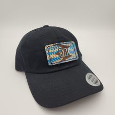 One of a kind hand painted leather patch on a Classic Yupoong Dad Cap. You get the exact hat pictured! Each hat features a patch of completely unique hand-marbled leather. 100% black cotton chino twill Unstructured, low-profile, six-panel, 3 1/8' crown Permacurv® visor Buckle closure with grommet Due to the nature of the process, each patch is completely unique and may include minor imperfections that distinguish it as a 100% authentic marbled item. Black Hat With Leather Patch One Size, Black Hats With Leather Patch, Black Hat With Leather Patch, One Size Fits Most, Black Hat With Leather Patch, Adjustable Baseball Cap With Leather Patch, Adjustable Black Hat With Embroidered Patch, Black Adjustable Hat With Embroidered Patch, Adjustable Flat Brim Hat With Leather Patch, Casual Hand Painted Cap