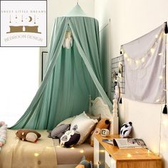 a bed with a canopy over it in a bedroom