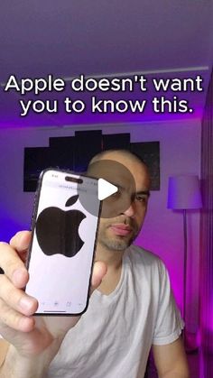 a man holding up an iphone with the caption apple doesn't want you to know this