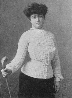 an old black and white photo of a woman holding a golf club