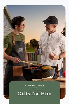 two men standing next to each other in front of a grill with food on it