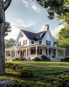 a large white house sitting in the middle of a lush green field next to trees