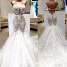 the back of a white wedding dress with sheer lace