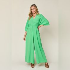 Features: Tied, Ruched Sheer: Opaque Material Composition: 95% Polyester, 5% Spandex Care Instructions: Machine Wash Cold. Tumble Dry Low. Imported Green V-neck Jumpsuit For Loungewear, Green Stretch Jumpsuits And Rompers For Spring, Green Stretch Jumpsuits And Rompers For Vacation, Green Jumpsuits And Rompers With Elastic Waistband For Spring, Green Stretch Jumpsuit For Vacation, Chic Green Jumpsuit With Elastic Waistband, Green Jumpsuits And Rompers For Spring Loungewear, Green Tie Waist Jumpsuits And Rompers For Spring, V-neck Jumpsuits And Rompers With Elastic Waistband For Spring