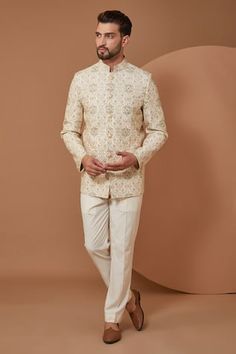 Ivory chanderi silk bandhgala with floral embroidery.
Components: 1
Pattern: Embroidery
Type Of Work: Floral
Neckline: Stand Collar
Sleeve Type: Full Sleeves
Fabric: Chanderi Silk
Color: Ivory
Other Details: 
Note: Pant worn by the model is not for sale
Occasion: Sangeet - Aza Fashions Bandhgala For Men, Groom Dress Men, Dress Men, Embroidery Floral, Silk Embroidery, Sequins Embroidery, Groom Dress, Embroidered Silk, Embroidery Flowers