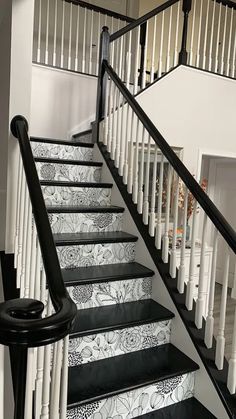 black and white stairs leading up to the second floor