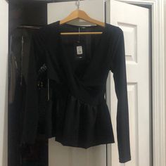 Super Cute Black Peplum Style Sexy Low Cut Blouse. Perfect With Jeans Or Slacks. Brand New With Tags. Size Medium. Chic Peplum Blouse For Evening, Fitted V-neck Top For Night Out, Peplum Blouse For Fall Party, Party Peplum Blouse For Fall, Fall Party Peplum Blouse, Fitted V-neck Party Blouse, Fall Peplum Blouse For Night Out, Chic Fitted Peplum Blouse, Chic Fitted Peplum Top For Party