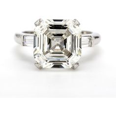 an emerald cut diamond ring with baguets