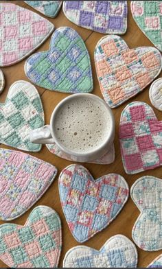 some heart shaped cookies and a mug on a table