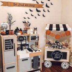 a halloween themed kitchen with black and white decor