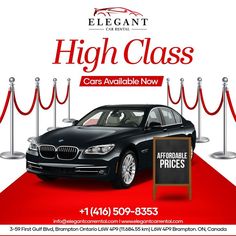 a black car parked next to a red carpet and roped off area with a sign that says high class