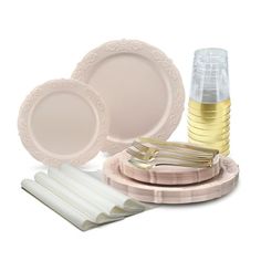 an assortment of plates and utensils on a white background with gold trimmings