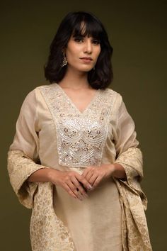 Ivory and beige kurta with placed cutdana and mirror embroidered floral patterns. Comes with pant and scarf style dupatta. - Aza Fashions Wedding Palazzo Set With Cutwork Straight Kurta, Festive Beige Kurta With Cutdana, Designer Beige Kurta With Cutdana, Designer Beige Cutdana Kurta, Elegant Chanderi Kurta With V-neck, Elegant Chanderi V-neck Kurta, Elegant V-neck Kurta With Zari Work, Cream Self Design Dupatta, Festive Beige Kaftan With Resham Embroidery