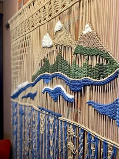 a wall hanging made out of woven material