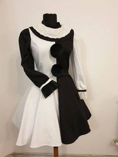 a black and white dress on a mannequin's dummy in a room