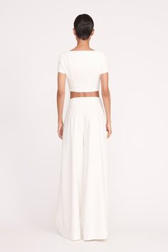 A square-neck, fitted short sleeve crop top made out of out stretchy tailoring crepe fabric. This style features seaming details fashioned after our signature Wells corseting. Short Sleeve Crop Top, Bride Accessories, Short Sleeve Cropped Top, Crepe Fabric, High Waisted Trousers, Well Dressed, Fashion Details, Hidden Zipper, Square Neck