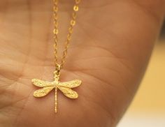 "Dragonfly Gold Necklace - 18ct gold Vermeil - Dragonfly Gold pendant,pretty, delicate, dainty this dragonfly necklace is delicate but eye catching It would make a very special gift for somebody you love :) MATERIALS - choose in the variation section on the checkout ;) * 18ct gold Vermeil * 14k gold filled chain * or all 925 sterling silver no plating DIMENSIONS: >Length of chain - 45cm/18\" (from clasp to end) >Width of pendant - 16.5mm/0.64\" >Length of pendant - 15.4mm/0.60\" The nec Handmade Gold Dragonfly Jewelry, Dainty Sterling Silver Dragonfly Jewelry, Elegant Gold Dragonfly Jewelry, Gold Dragonfly Necklace For Gift, Elegant Sterling Silver Dragonfly Necklace, Yellow Gold Dragonfly Jewelry Gift, Yellow Gold Dragonfly Jewelry For Gifts, Elegant Gold Dragonfly Necklace, Delicate Gold Butterfly Necklace