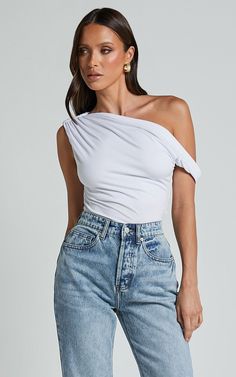 Jialeen Top - Off Shoulder Twist Asymmetrical Sleeve Top in White | Showpo USA White Tops With Asymmetrical Neckline For Summer, Trendy White Off-shoulder Crop Top, Stretchy One Shoulder Crop Top For Summer, Stretch One Shoulder Crop Top For Summer, Stretchy Summer Crop Top With One Shoulder, Chic Asymmetrical Off-shoulder Top For Summer, White Stretch One-shoulder Crop Top, Cotton One Shoulder Top With Asymmetrical Neckline, Versatile Asymmetrical One Shoulder Top For Summer