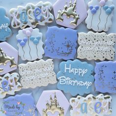 decorated cookies with happy birthday messages and balloons on them for a child's first birthday