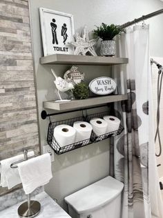 a bathroom with two shelves above the toilet