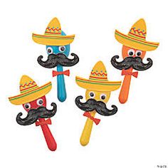 three plastic mustaches with hats on them are in the shape of sombrero