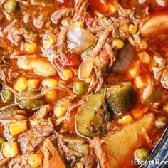 a pot full of stew with meat, vegetables and beans in it's broth