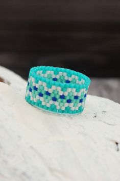 Boho beaded ring made of Japanese seed beads Delica size 11 Shades of blue, mint and white Band width is approx 3/8 inches ( 10 mm ) - 8 rows #Turquoise_blue_ring #Blue_Band_ring #Boho_Ring #Dainty_ring #Cute_ring #Beaded_Ring #Something_Blue #Trendy_ring #Seed_Bead_Rings Ring Patterns, Ring For Women Unique, Butterfly Wing Earrings, Huichol Art, Writing Gifts, Trendy Ring, Unusual Jewelry, Wing Earrings