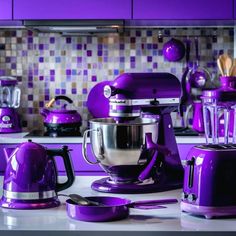 purple kitchen appliances sitting on top of a counter