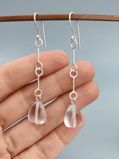 These lovely earrings are made by me. I used traditional metalsmithing techniques, soldering, hammering, melting.  The result is a clean modern style earrings, you can wear every day with anything! The natural stones are Quartz shaped like large rain drops. The total length is about 68 mm, the width is 12mm. I will post in a small gift box. Thank you for supporting handmade! Small Gift Boxes, Lovely Earrings, Support Handmade, Clean Modern, Style Earrings, Small Gift, Rain Drops, Style Moderne, Easy Wear