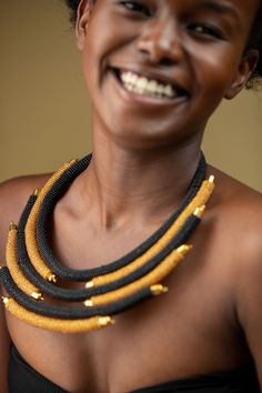 Unique African Maasai Handcrafted Beaded Necklace with an Elegant Look and Brilliant Finish. **GET FREE SHIPPING FOR ADDITIONAL ITEMS PURCHASED. Size(Around the Neck)-16 Inches. Color-Black and Gold. Get a pair of Matching Earrings and 2 Bracelets for an extra $7. Yes, Buy Multiple Items and pay shipping for 1 item only- The rest ships Free. (No Limits on the number of Multiple items). With a faster delivery time of 3 days via DHLExpress, Worldwide. Ordinary/Standard Shipping also available upon Artisan Black Beaded Chain Jewelry, Black Artisan Beaded Chain Jewelry, Artisan Black Necklace With Beaded Chain, Artisan Black Beaded Chain, African Quilts, Woman Necklace, Necklace African, Handmade Beaded Necklace, African Necklace