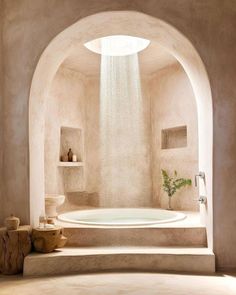 a large white bath tub sitting inside of a bathroom