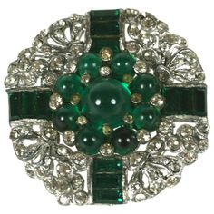 Art Deco Emerald Cab Brooch from the 1930's. High quality manufacture with channel set emerald paste baguettes and cabochons. Likely unsigned Trifari. 1.4" across. USA 1930's. 1930 Jewelry, Emerald Brooch, Art Deco Emerald, Channel Set, High Jewelry, Ornament Wreath, Jewelry Designs, Costume Jewelry, Brooch Pin