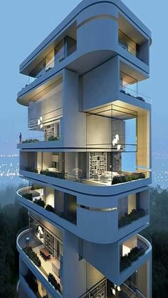 an apartment building with balconies and plants on the balconys at night time