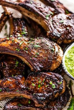 grilled steaks with chimica sauce and parsley garnish on the side