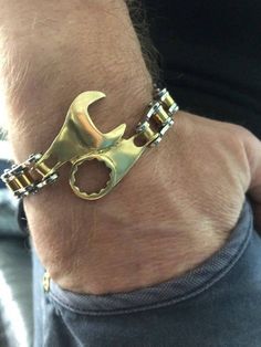 This “timing spanner” bracelet made of 14K White & Yellow Gold.Gold Bike chain links & piston clasped. afflink Bracelet Men Gold, Fabrikasi Logam, Gold Motorcycle, Chain Bracelet Men, Guy Jewelry, Biker Bracelet, Mens Chain Bracelet, Diy Ring, Biker Gifts