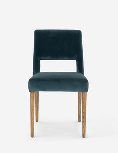 a dark blue chair with wooden legs and backrests, against a white background