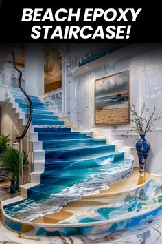 the stairs are painted with blue and white paint on them, as well as an ocean scene