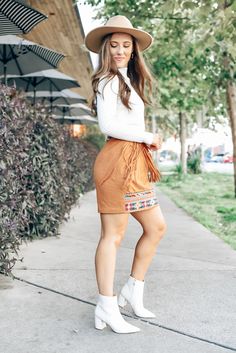 Turn heads in this stunning fringe detailed suede camel skirt. Pair with a white sweater and booties to complete the perfect fall look. We love this skirt for date night, fall family photos or catching dinner with friends! Fringe suede skirt Colorful trim detail Zipper closure in back Fully lined Runs big, if in between sizes order 1 size down Piper is 5'3, wears a size 2 and is wearing a Small! Colorful Trim, Camel Skirts, Fall Family Photos, Dinner With Friends, Suede Skirt, Fall Family, White Sweater, Mountain Views, Trim Detail